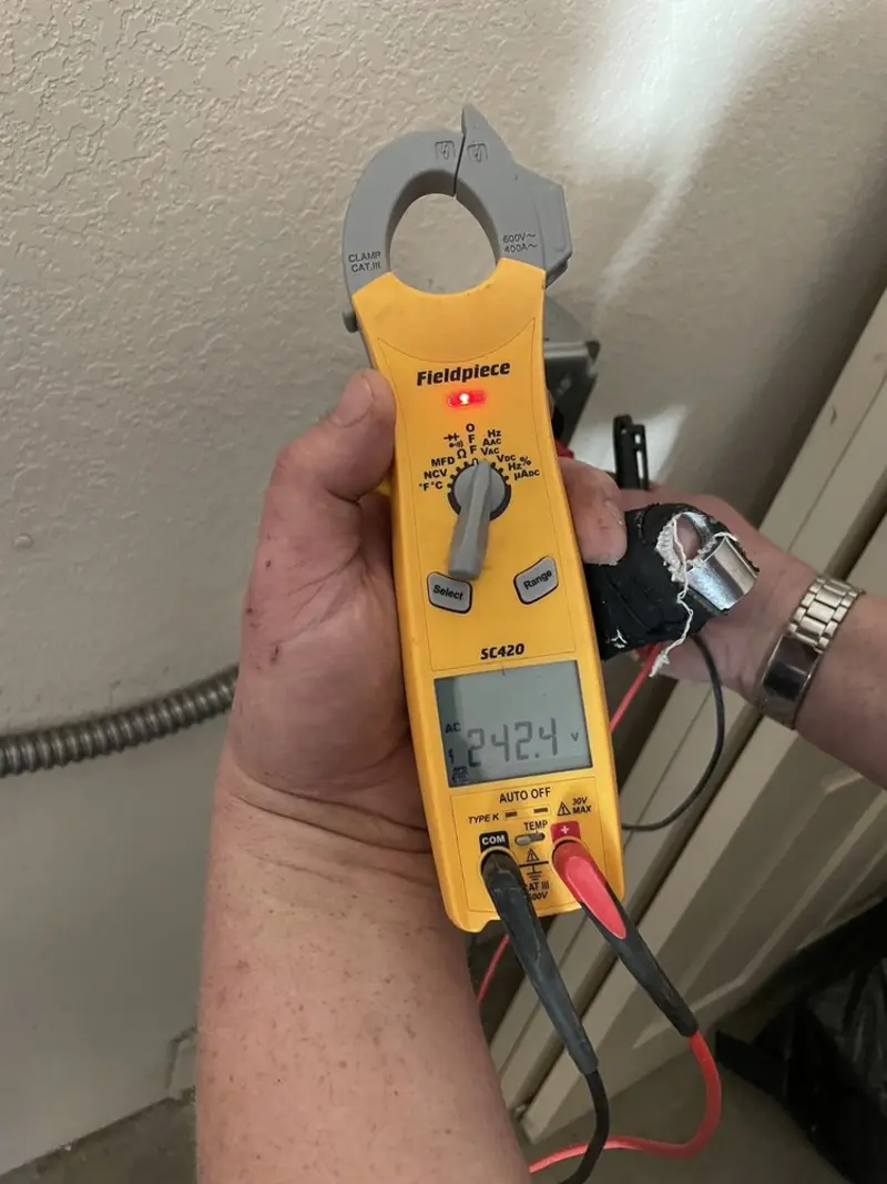 Voltage testing with clamp meter during Generator Installation in Stone Mountain